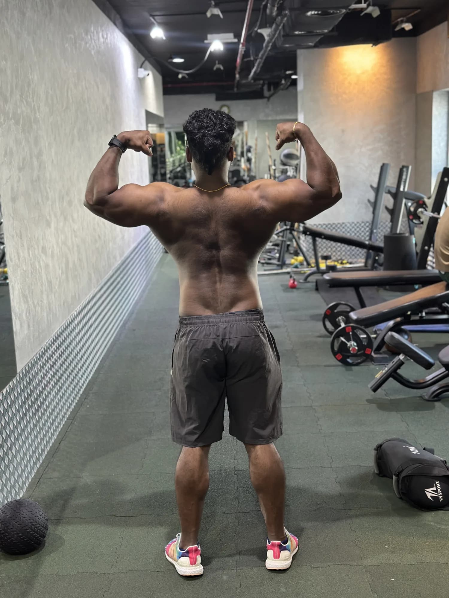 Maxwell athlete, back pose in the gym